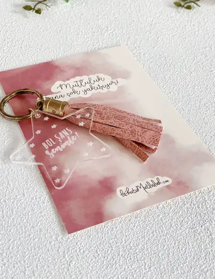 Şeffaf Anahtarlık - Pembe Püskül Bol Şans Seninle Yıldız Anahtarlık